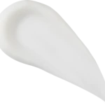 Close-up of a smooth white curved surface with soft shadows, creating an abstract image.
