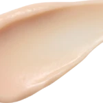 Beige cream swatch with smooth, creamy texture on a white background (cosmetic product).