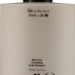 Beige shampoo bottle with black pump; label reads 'Take a shower, Wash off the day' and 'Black Tea Nourishing Scalp Shampoo'