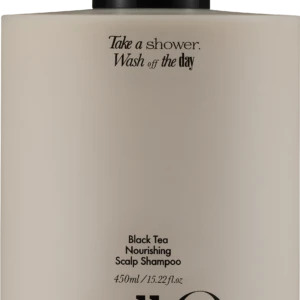 Beige shampoo bottle with black pump; label reads 'Take a shower, Wash off the day' and 'Black Tea Nourishing Scalp Shampoo'