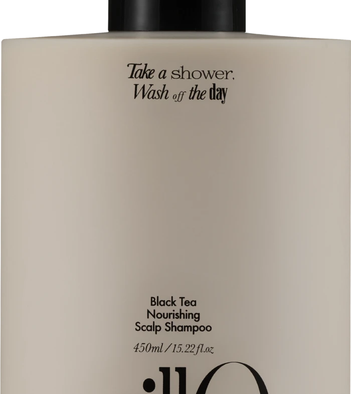 Beige shampoo bottle with black pump; label reads 'Take a shower, Wash off the day' and 'Black Tea Nourishing Scalp Shampoo'