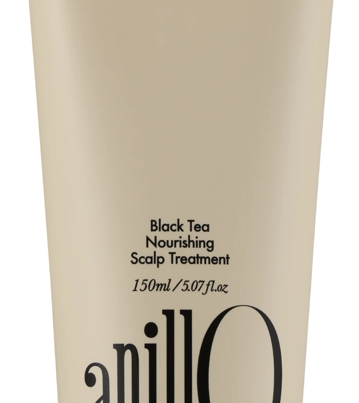 Beige cosmetic tube labeled 'Black Tea Nourishing Scalp Treatment' (150 ml) with a black cap; top reads 'Take a shower, Wash off the day'.