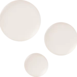 Several white, oval pills scattered on a black background.