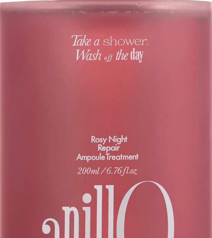 Pink bottle labeled 'Rosy Night Repair Ampoule Treatment' with white cap; tagline 'Take a shower. Wash off the day' (200 ml).