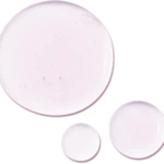 Abstract composition of pale pink circular shapes overlapping on a black background.