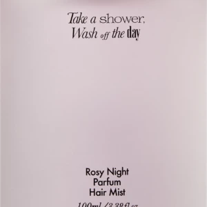 Light pink perfume bottle with a tall black cap; label reads 'Take a shower, Wash off the day' and 'Rosy Night Parfum Hair Mist, 100 ml'.