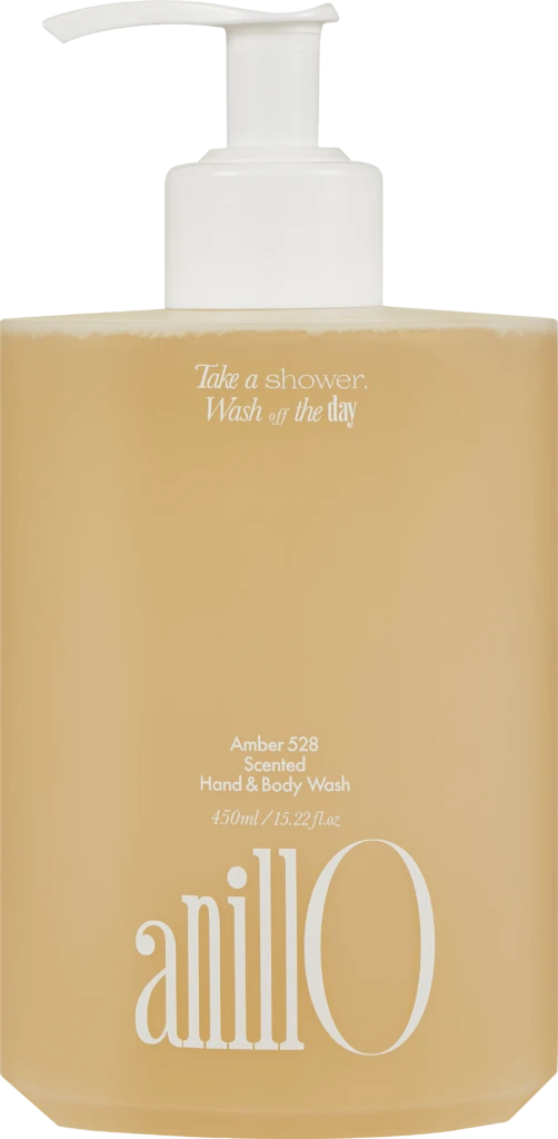 White pump bottle of Amber 528 scented hand and body wash with a peach label; slogan 'Take a shower, Wash off the day' and 450 ml capacity visible.