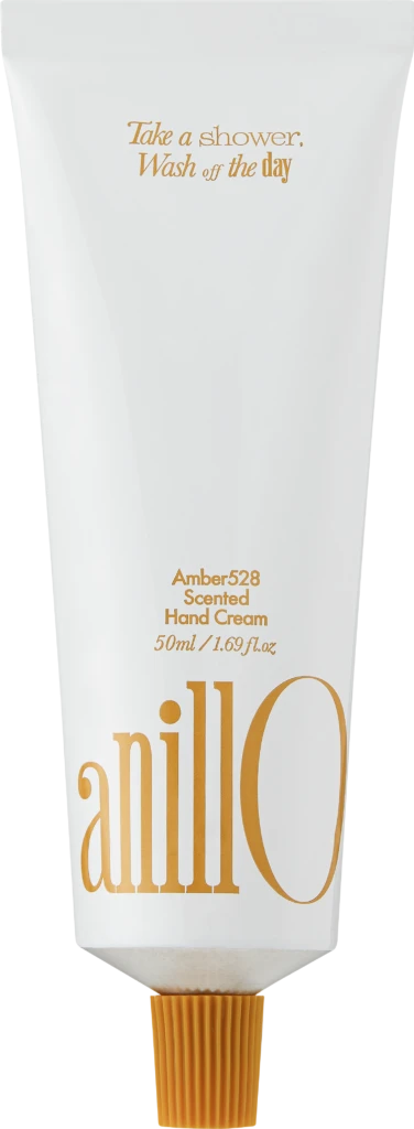 White hand-cream tube with orange lettering, reading 'Amber528 Scented Hand Cream' and '50ml / 1.69 fl. oz', bottom orange cap; includes a decorative wordmark along the side and the phrase 'Take a shower, Wash off the day' near the top.