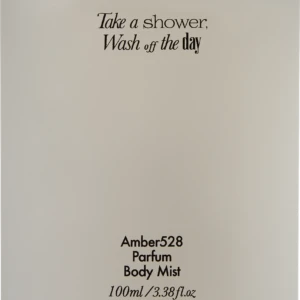 Cream perfume bottle with black cap; label reads “Take a shower, Wash off the day,” and “Amber528 Parfum Body Mist, 100ml”