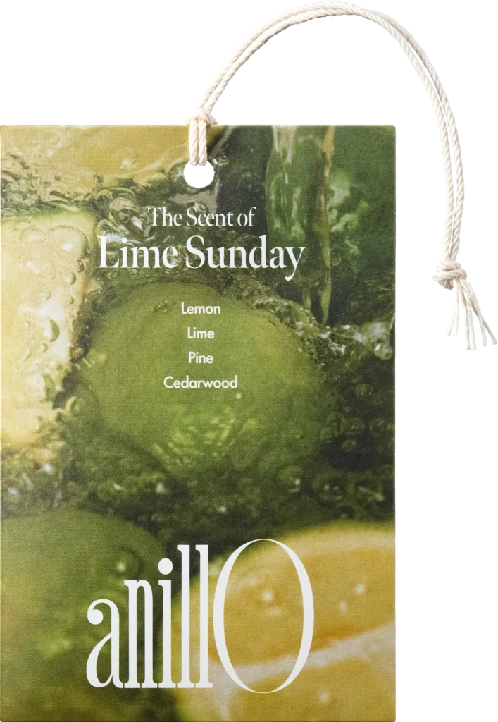 Tag advertising 'The Scent of Lime Sunday' with scent list Lemon, Lime, Pine, Cedarwood, tied with a rope loop
