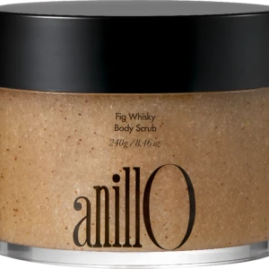 Close-up of a jar with a black lid containing Fig Whisky Body Scrub; beige, speckled scrub visible.