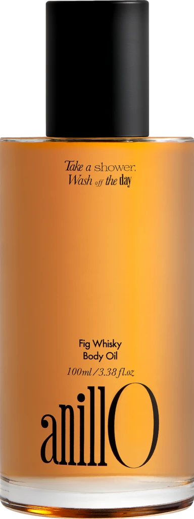 Bottle of amillO Fig Whisky Body Oil with a black cap and orange gradient label; slogan reads 'Take a shower, Wash off the day' (100 ml).