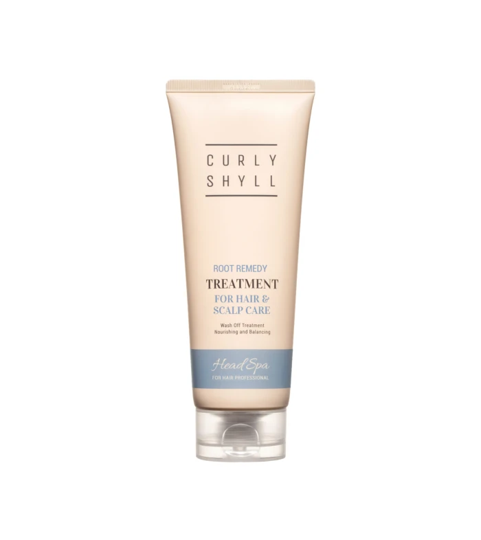 Beige tube of hair treatment standing upright with the words Curly Shyll and treatment for hair & scalp care visible on the label.