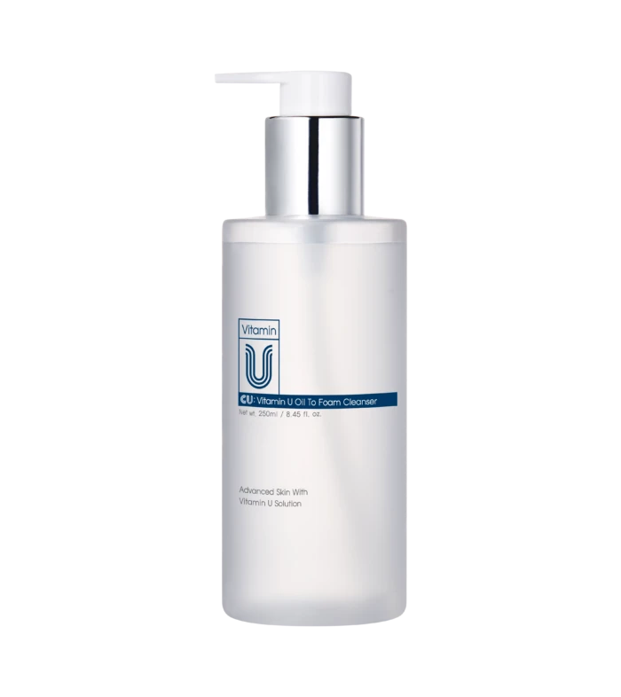 White pump dispenser bottle for Vitamin U Oil-to-Foam Cleanser against a black background, front view.