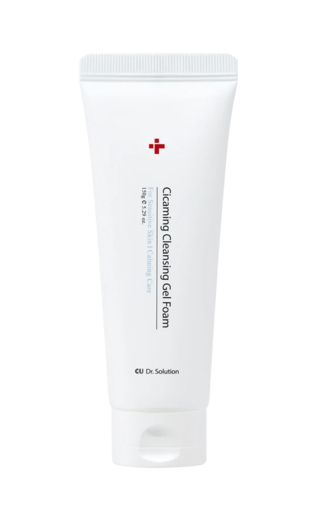 White tube of cleansing gel foam with red cross logo; label reads 'Cleansing Gel Foam' and 'For Sensitive Skin' on black background.