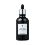 Dark glass dropper bottle with a silver collar and white label reading Niacin 10% Vitamin C Ampoule against a black background, close-up.