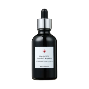 Dark glass dropper bottle with a silver collar and white label reading Niacin 10% Vitamin C Ampoule against a black background, close-up.