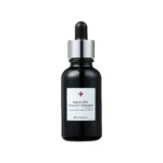 Close-up of a dark glass serum bottle neck with a dropper-cap and silver collar; label reads Niacin 20% Vitamin C Ampoule (cosmetic serum)