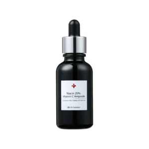 Close-up of a dark glass serum bottle neck with a dropper-cap and silver collar; label reads Niacin 20% Vitamin C Ampoule (cosmetic serum)
