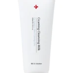 White squeeze tube labeled 'Cleansing Milk' for sensitive skin, red cross logo, Dr. Solution branding.