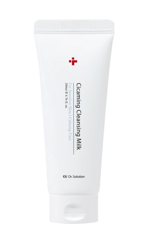White squeeze tube labeled 'Cleansing Milk' for sensitive skin, red cross logo, Dr. Solution branding.