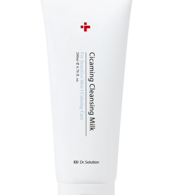 White squeeze tube labeled 'Cleansing Milk' for sensitive skin, red cross logo, Dr. Solution branding.