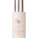 Close-up of a light pink pump bottle with a metallic silver pump, label shows 'PDRN BAKUCHIOL AMPOULE 100' against a black background