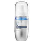 Vitamin C Serum Mist bottle with a white pump and clear cap, silver body and blue accent band on the label.