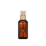 Brown glass hair product bottle with a gold spray pump and clear cap, labeled Babassu Oil for Hair in gold lettering.
