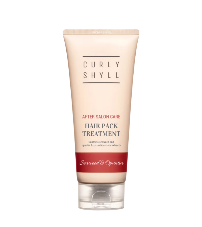 Tube of hair treatment product labeled Curly Shyll with 'After Salon Care' and 'Hair Pack Treatment' text in a pale pink container against a light background.