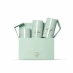 Mint-green gift box with three natural deodorant bottles in pale-green containers, arranged in a carry-friendly carton.