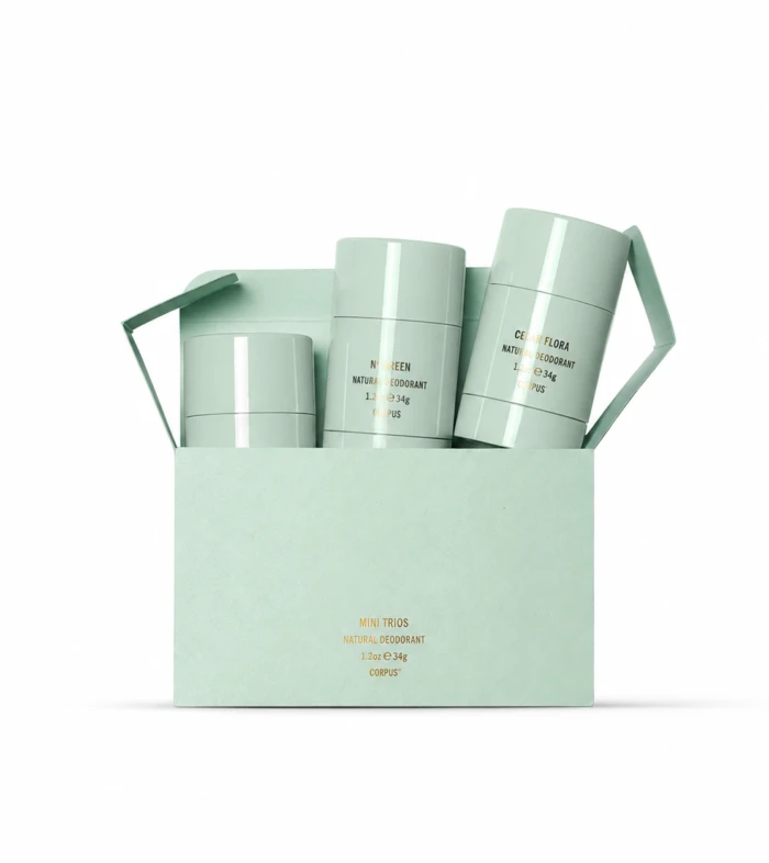 Mint-green gift box with three natural deodorant bottles in pale-green containers, arranged in a carry-friendly carton.
