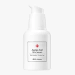 White pump bottle labeled Azelaic Acid 10% Serum for skin care and trouble care