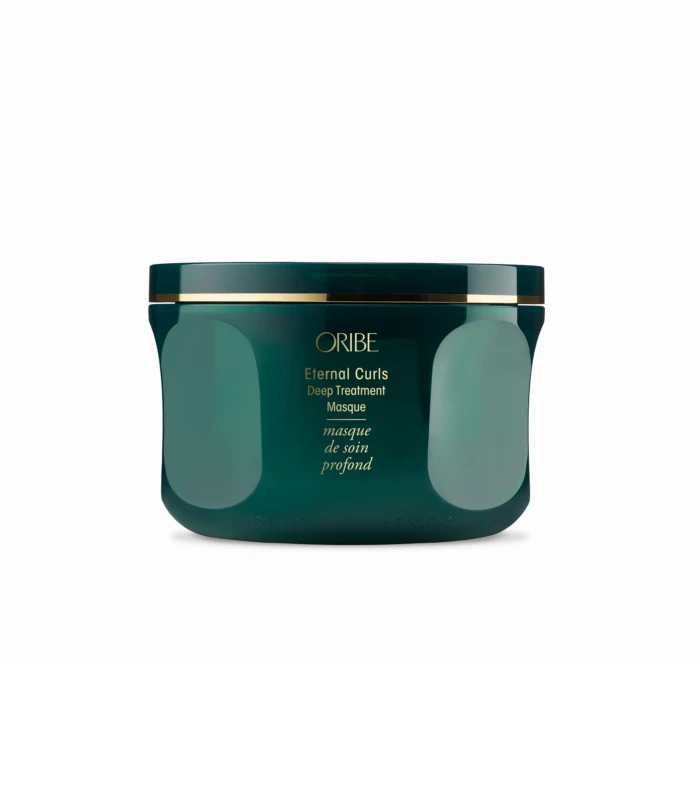 Close-up of a teal jar with a gold band, labeled Oribe Eternal Curls Deep Treatment Masque, seen from the front at the bottom of the image.
