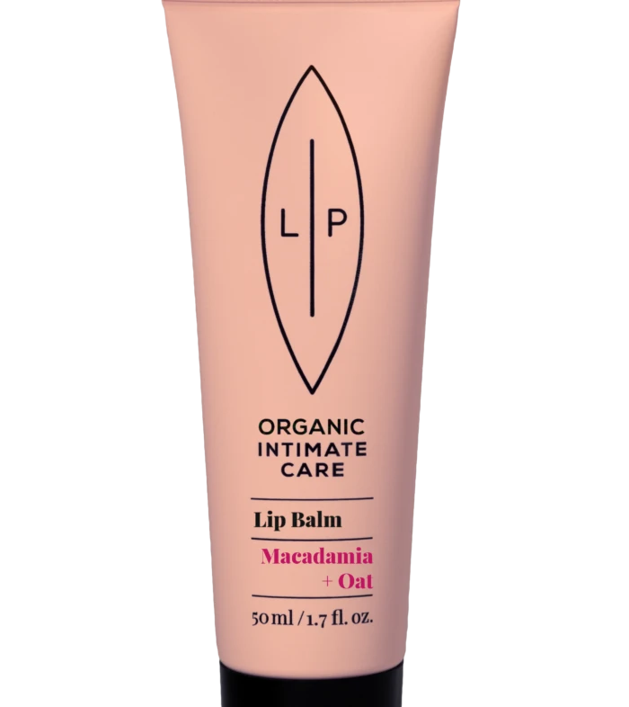 Pink lip balm tube with black cap, logo and product name visible: Organic Intimate Care Lip Balm in Macadamia + Oat, 50 ml/1.7 oz