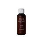 Real Argan repairing shampoo bottle with white cap, brown bottle, label showing REAL ARGAN and COLD PRESSED ARGAN OIL