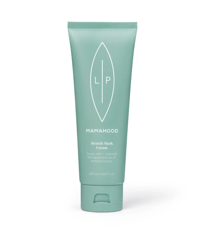 Teal-green squeeze tube of Mamahood Stretch Mark Cream with white leaf logo on a white background, standing upright.