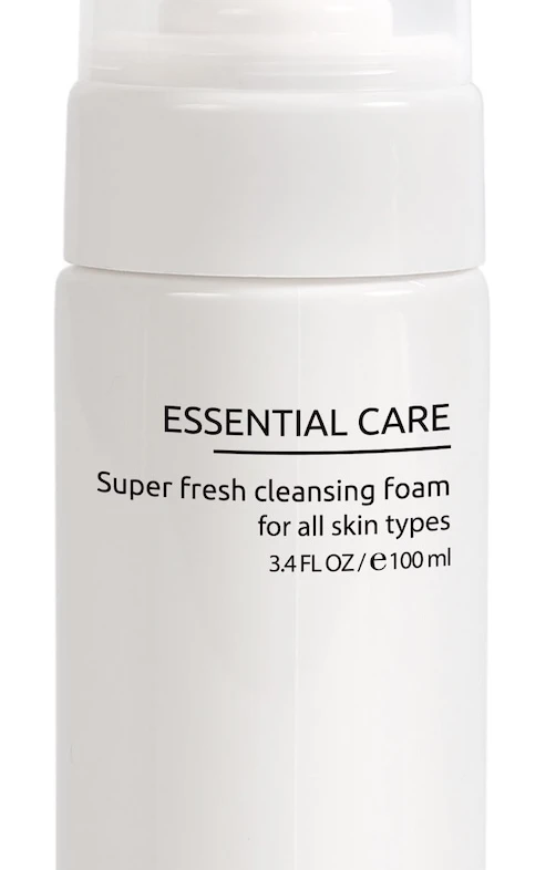 Dermaskill Essential Care cleansing foam bottle with pump dispenser; reads 'Super fresh cleansing foam for all skin types'.