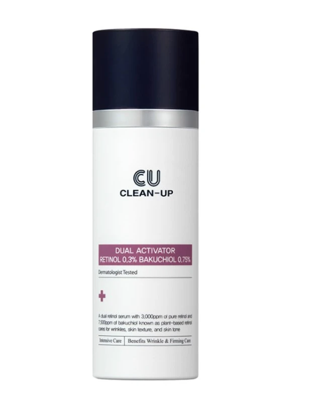 White cylindrical cosmetic bottle with a dark navy cap; label reads 'CU CLEAN-UP' and 'Dual Activator Retinol 0.3% Bakuchiol 0.75%'