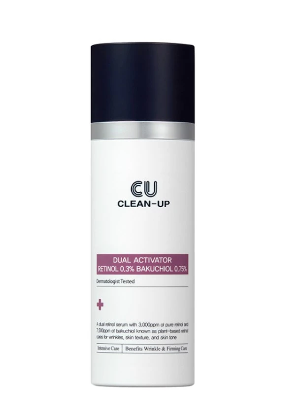 White cylindrical cosmetic bottle with a dark navy cap; label reads 'CU CLEAN-UP' and 'Dual Activator Retinol 0.3% Bakuchiol 0.75%'