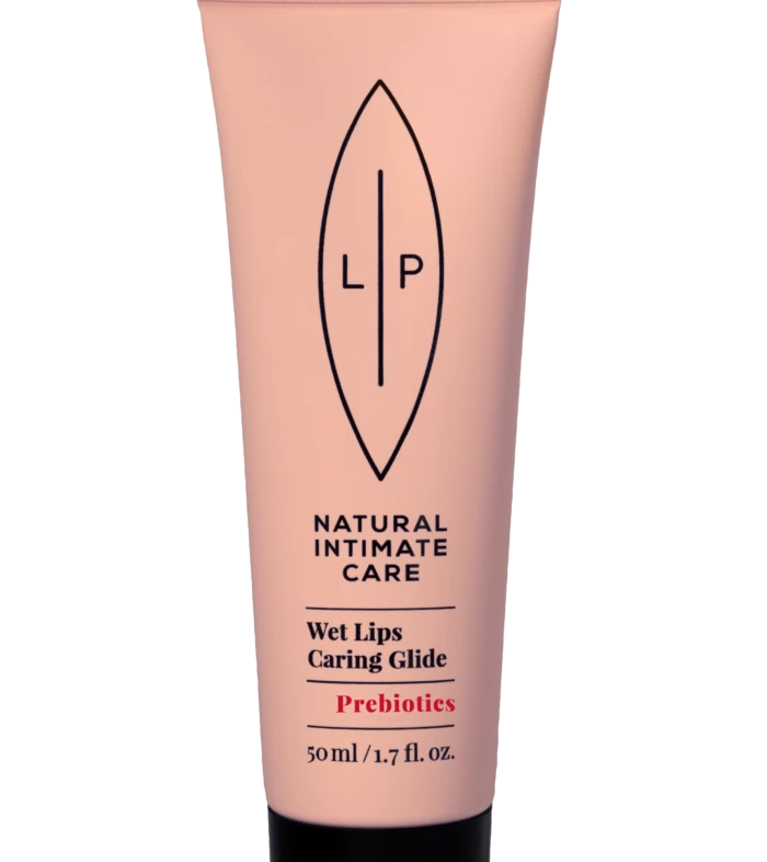 Pink squeeze tube of natural intimate care product with LP logo and text 'Wet Lips Caring Glide' and 'Prebiotics' (50 ml)