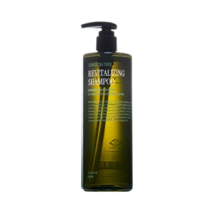 Bottle of revitalizing shampoo with pump dispenser labeled 'Revitalizing Shampoo' and citrus-tea tree design on dark green bottle